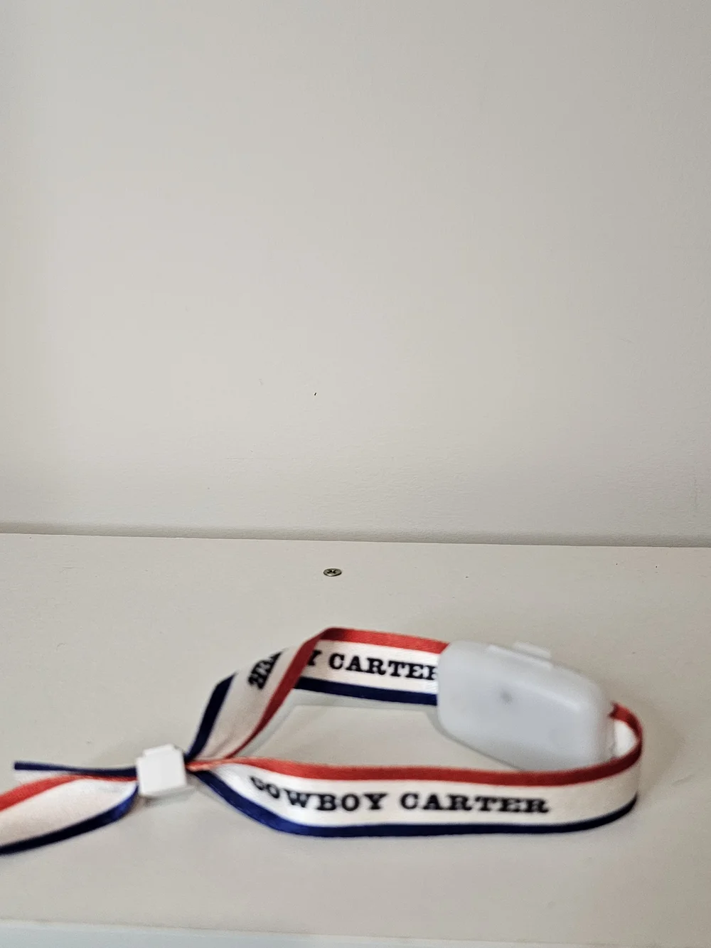 White Wireless Earbuds with Red, White & Blue Strap